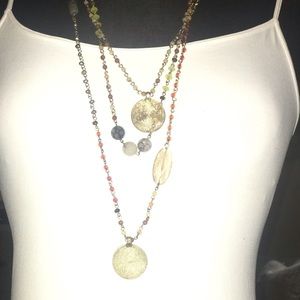 Beautiful beaded and hammered gold necklace.